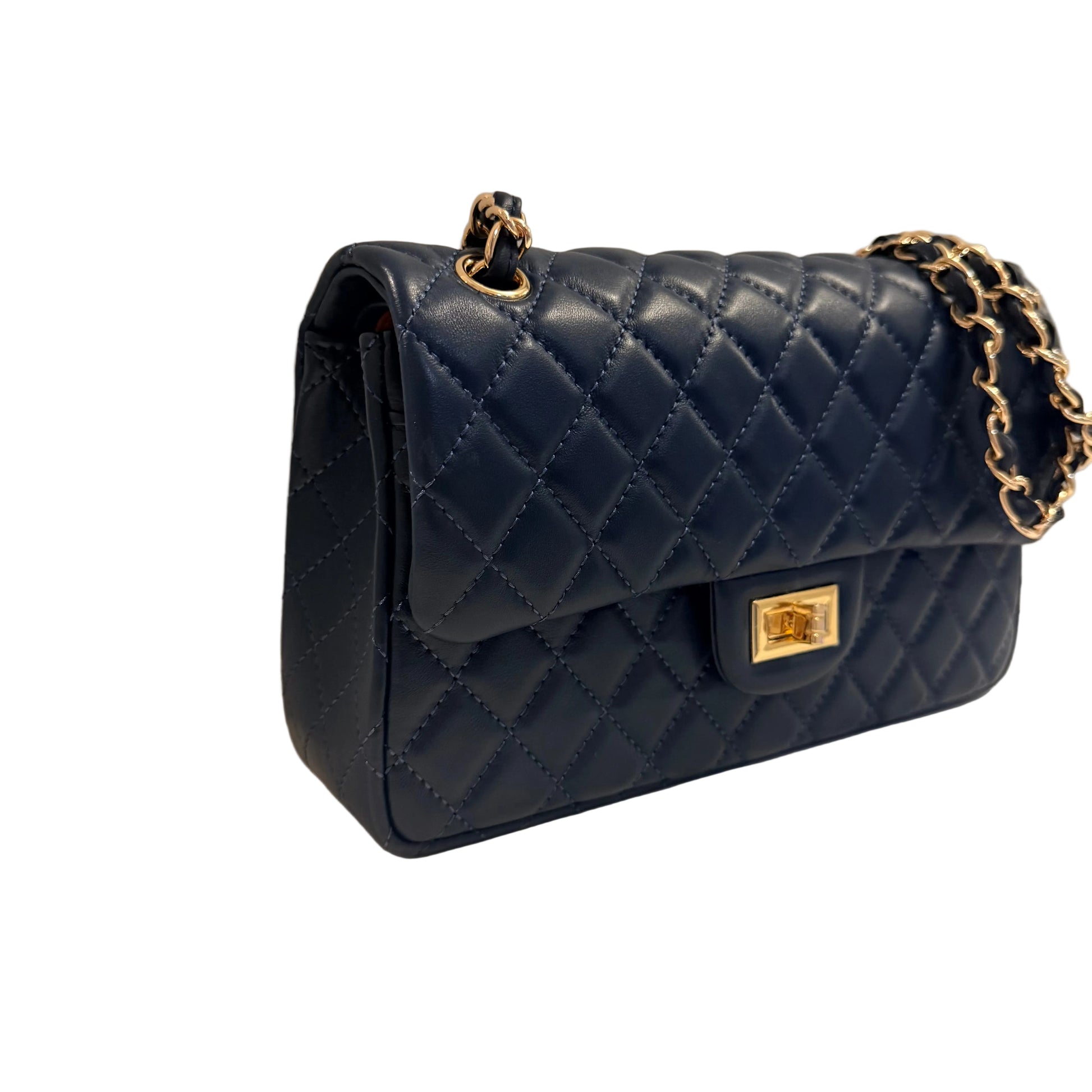 Quilted navy blue handbag with gold chain strap on a neutral background