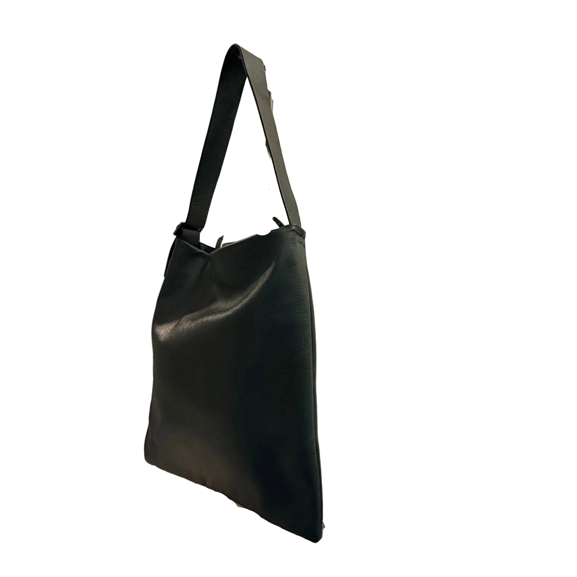 Black leather handbag on a stand against a neutral background