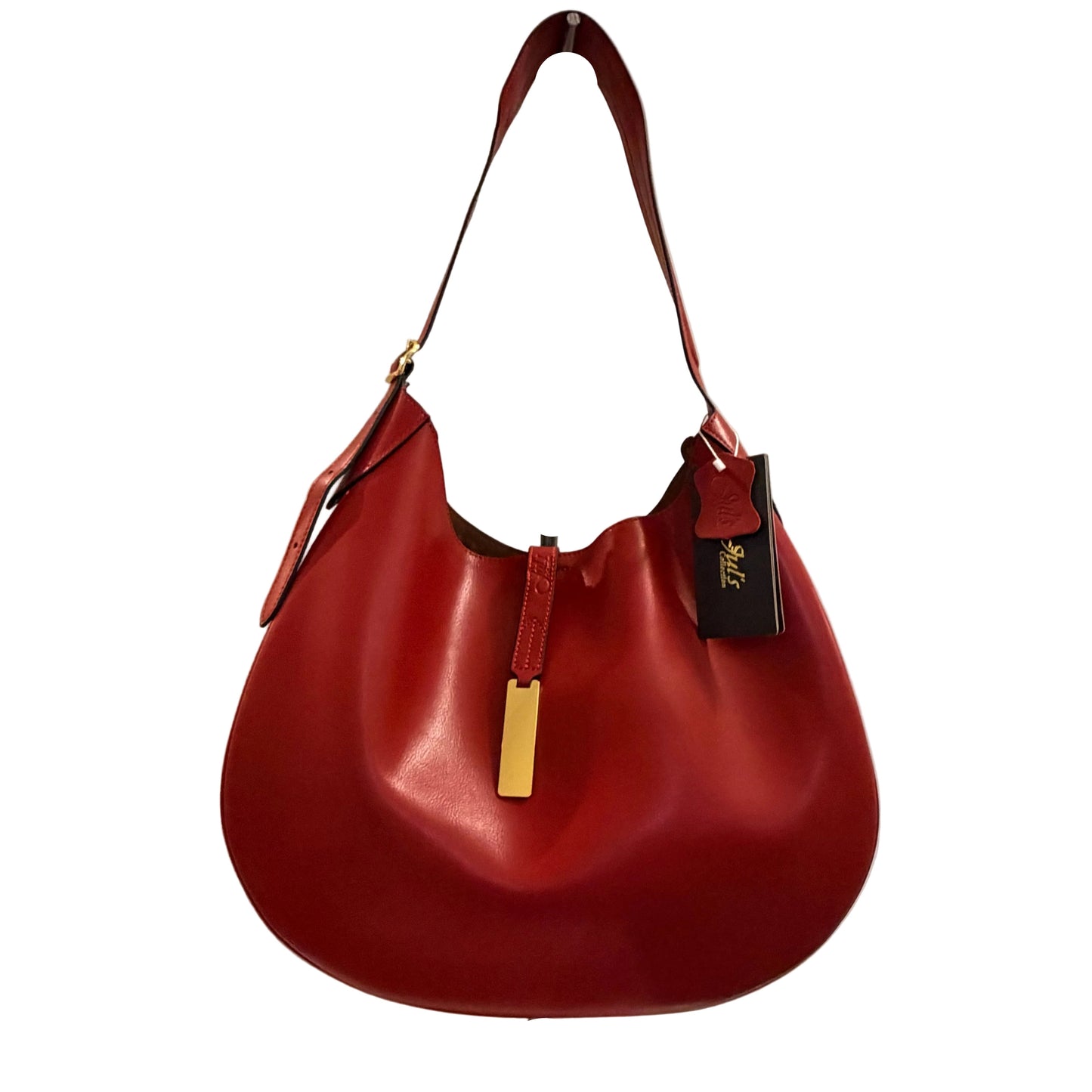 Red handbag with a gold tag on a neutral background