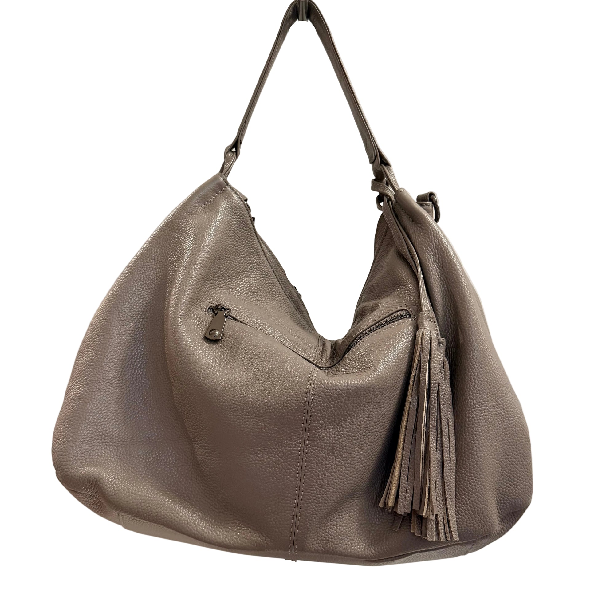 Gray handbag with a tassel on a stand against a plain background
