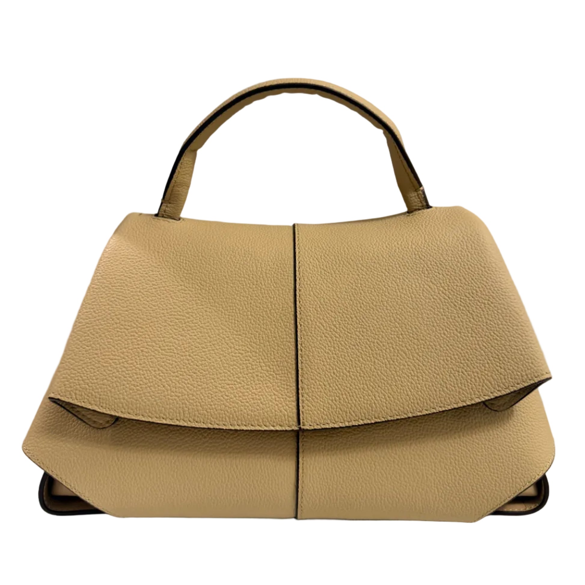 Beige handbag on a white surface with a neutral background