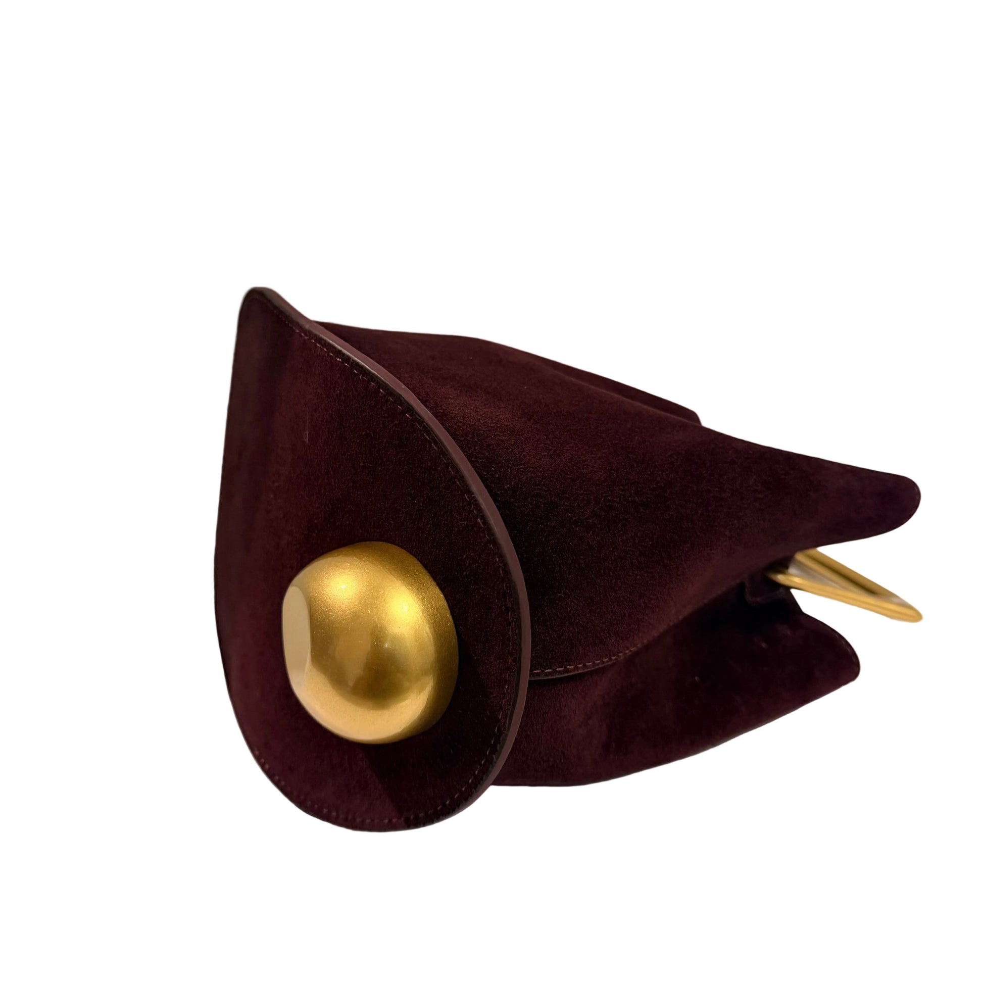 Maroon clutch bag with a gold button on a white surface