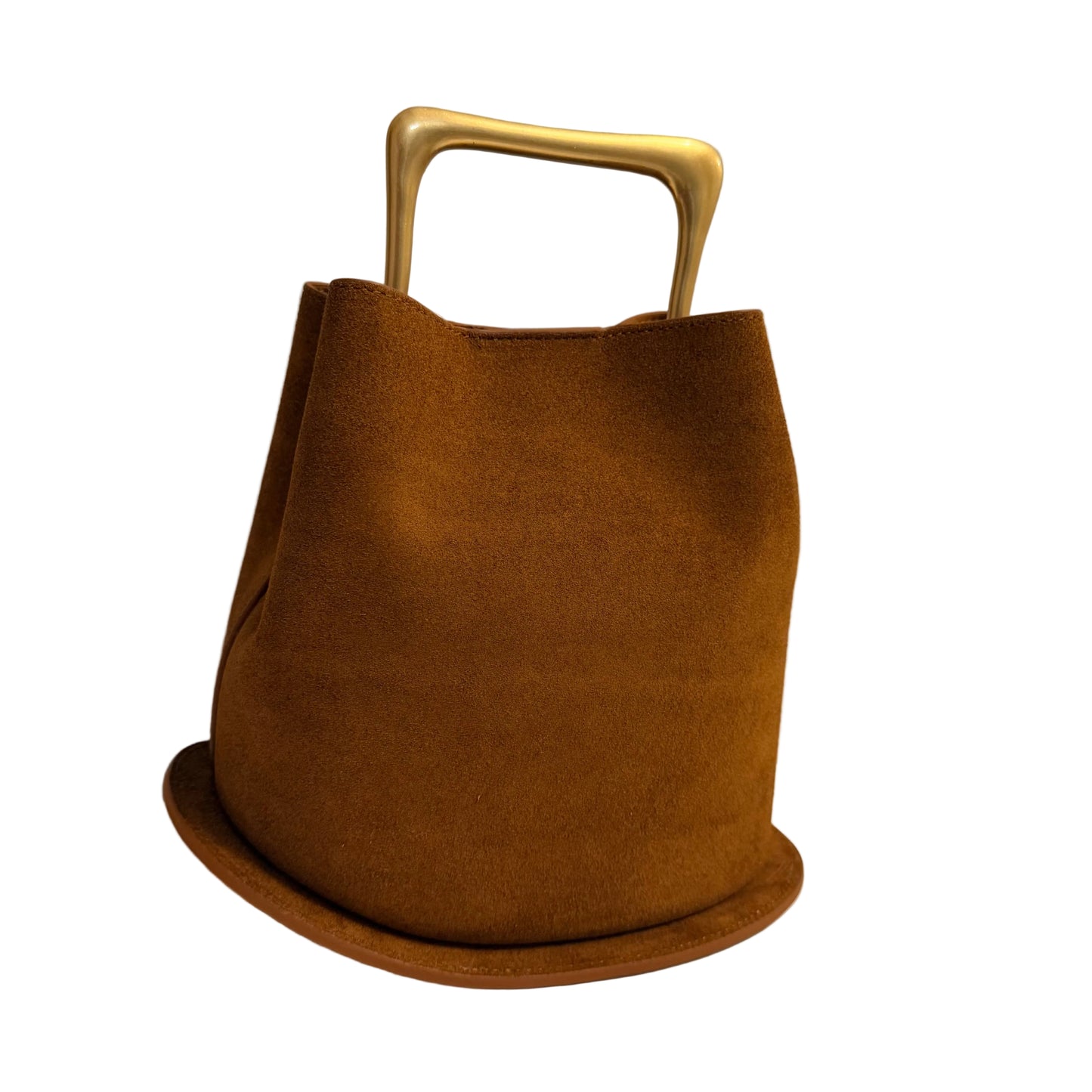 Brown bag with a gold handle on a white surface and gray background