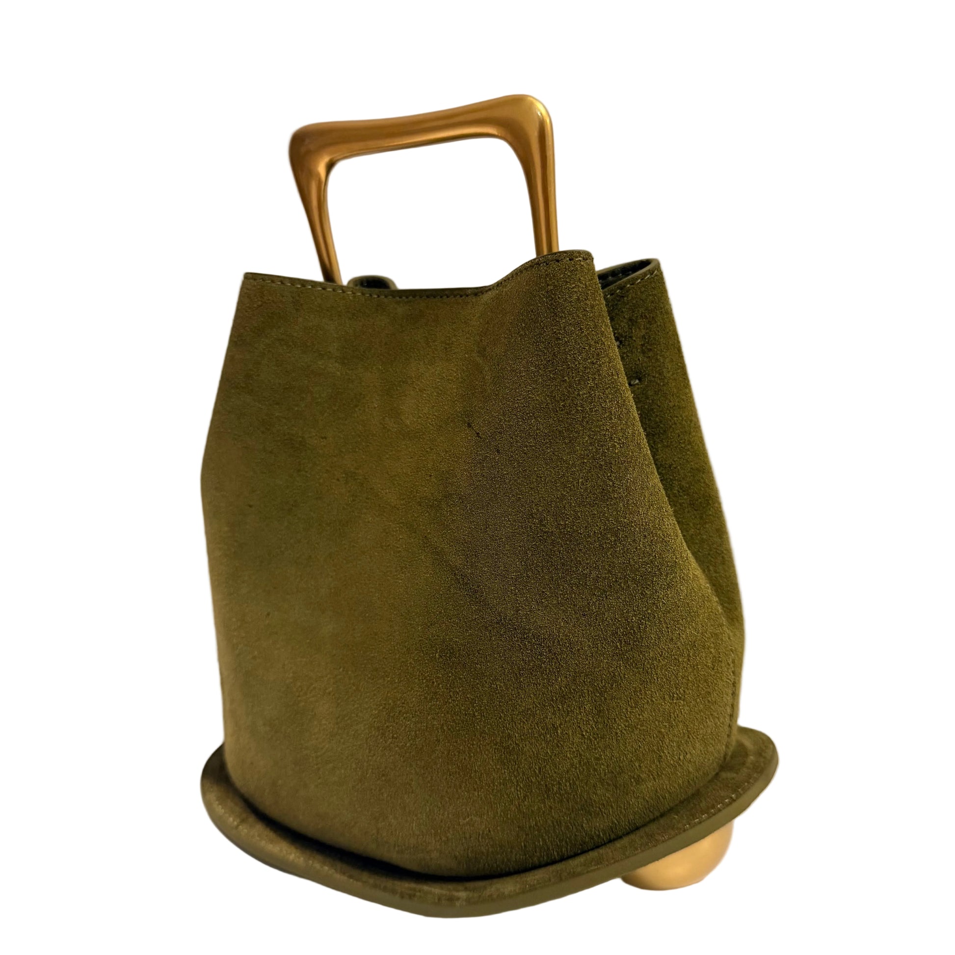 Green suede handbag with gold handle and base on a white surface