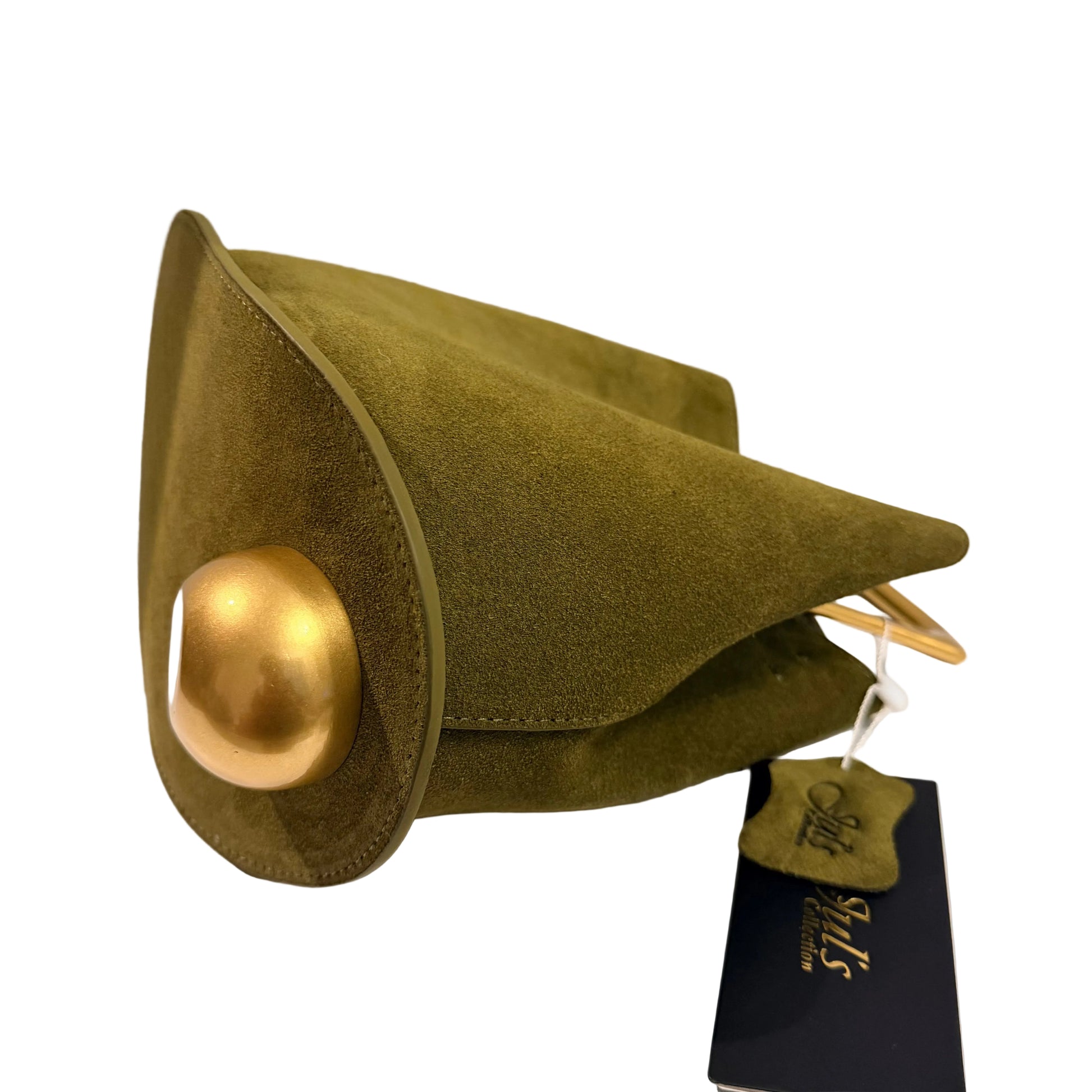 Green felt hat with gold button on a white surface, featuring a tag.