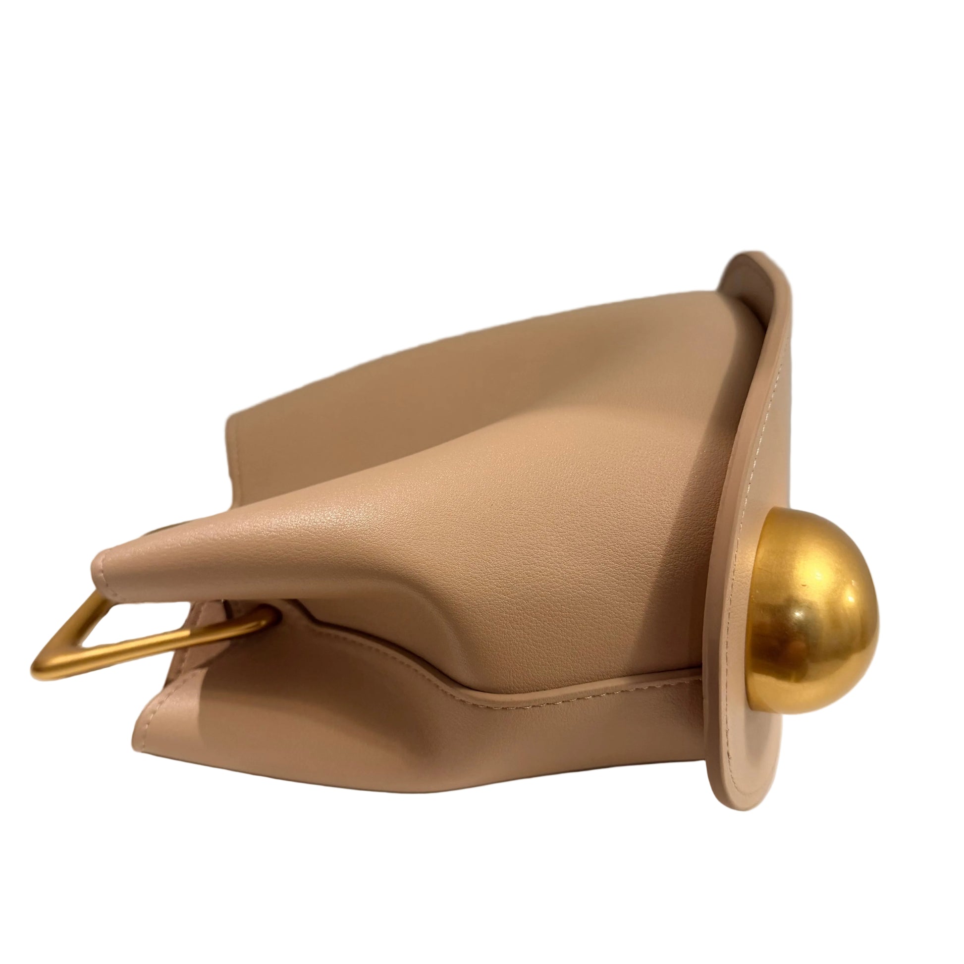 Beige handbag with a gold handle on a white surface