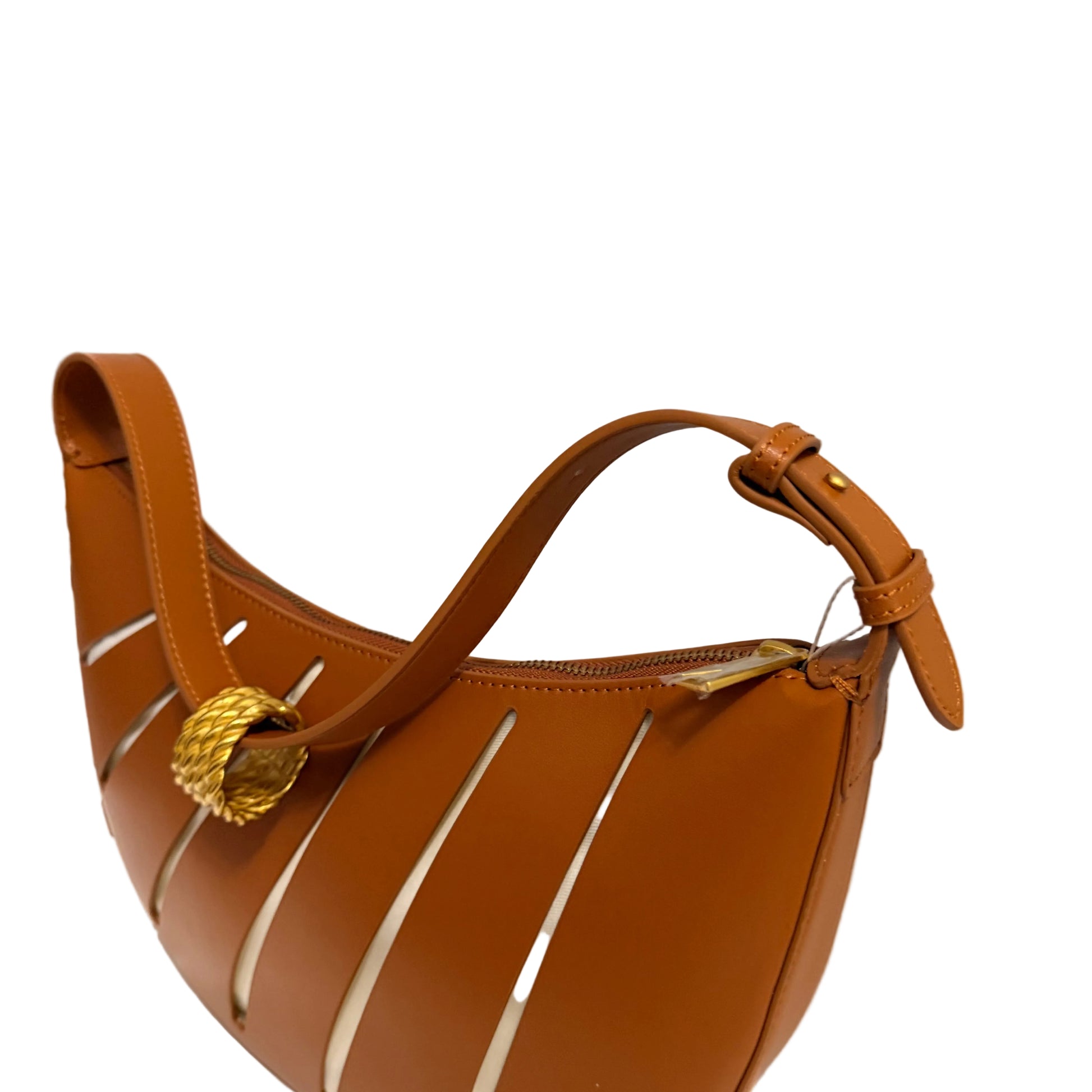 Brown handbag with gold accents on a white surface