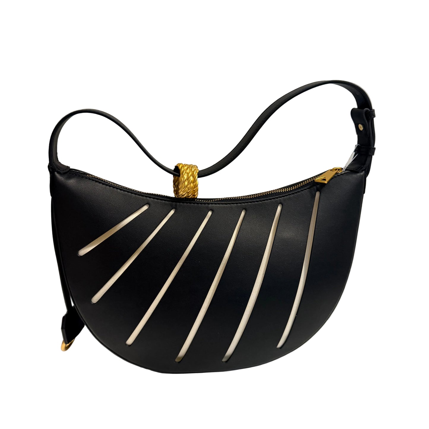 Black handbag with gold accents on a light gray background