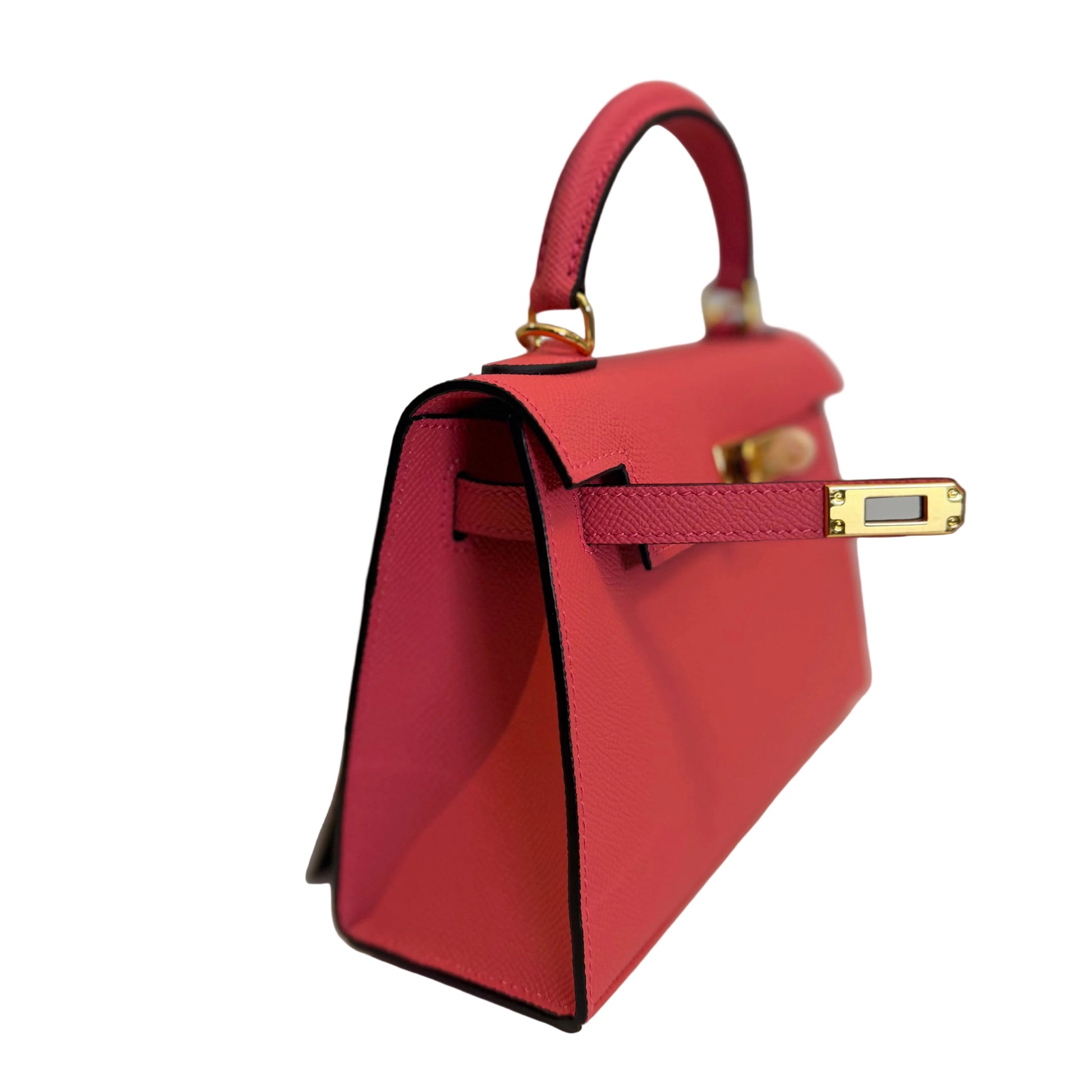 Red handbag with gold accents on a light background