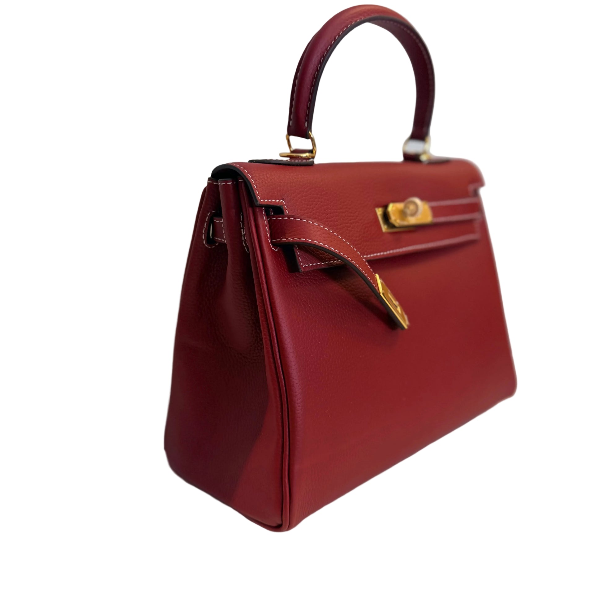 Red handbag with gold accents on a light gray background