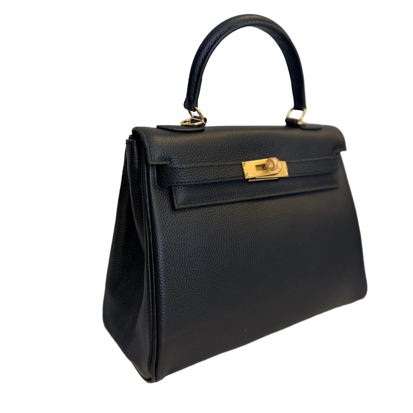 Black handbag with gold hardware on a light gray background