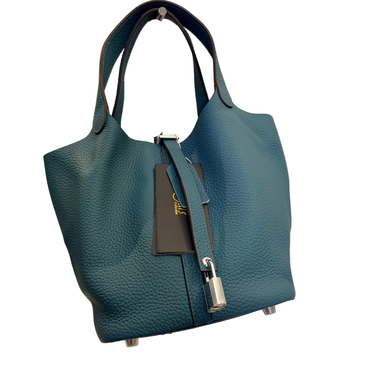 Blue textured handbag on a stand against a neutral background