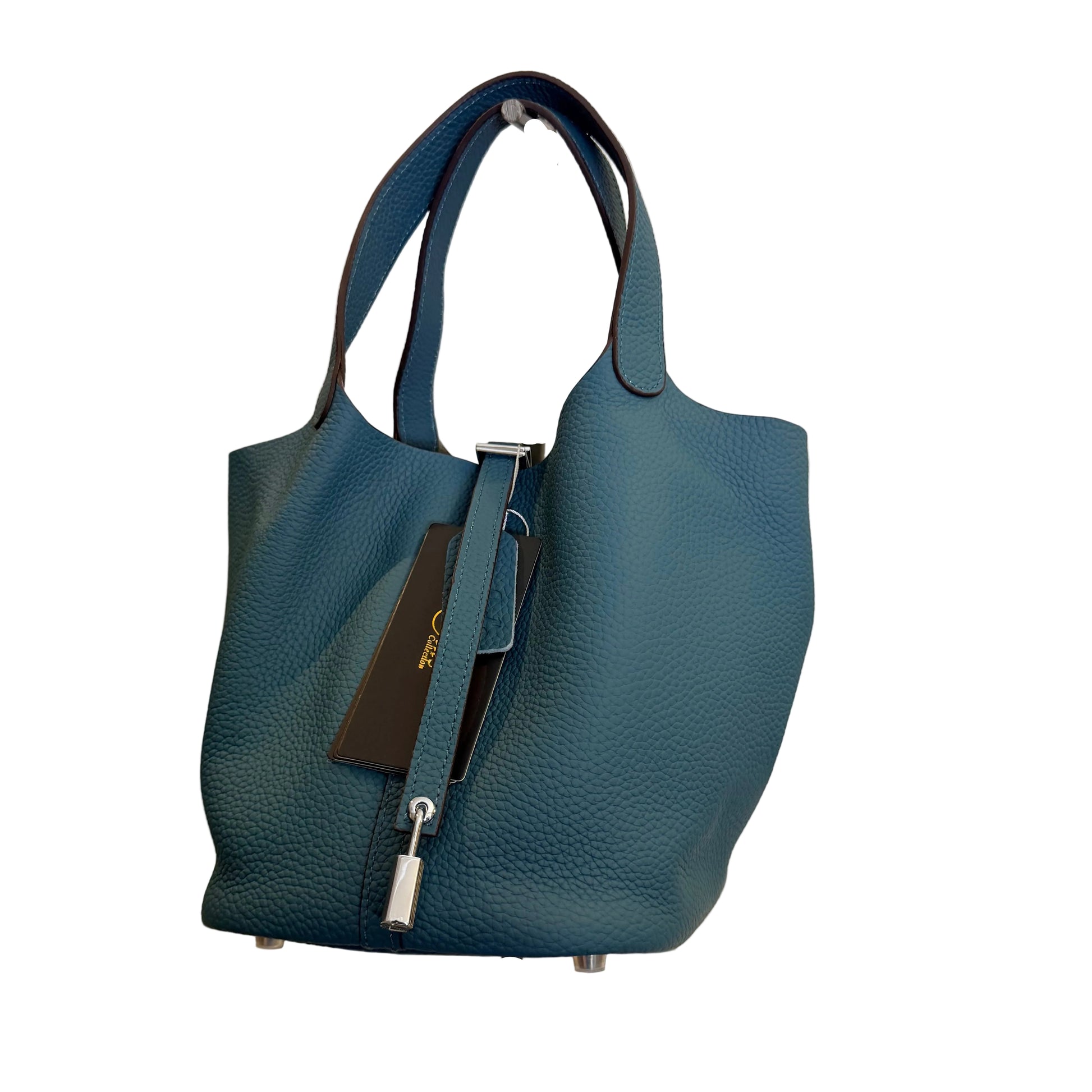 Blue handbag on a stand against a light gray background
