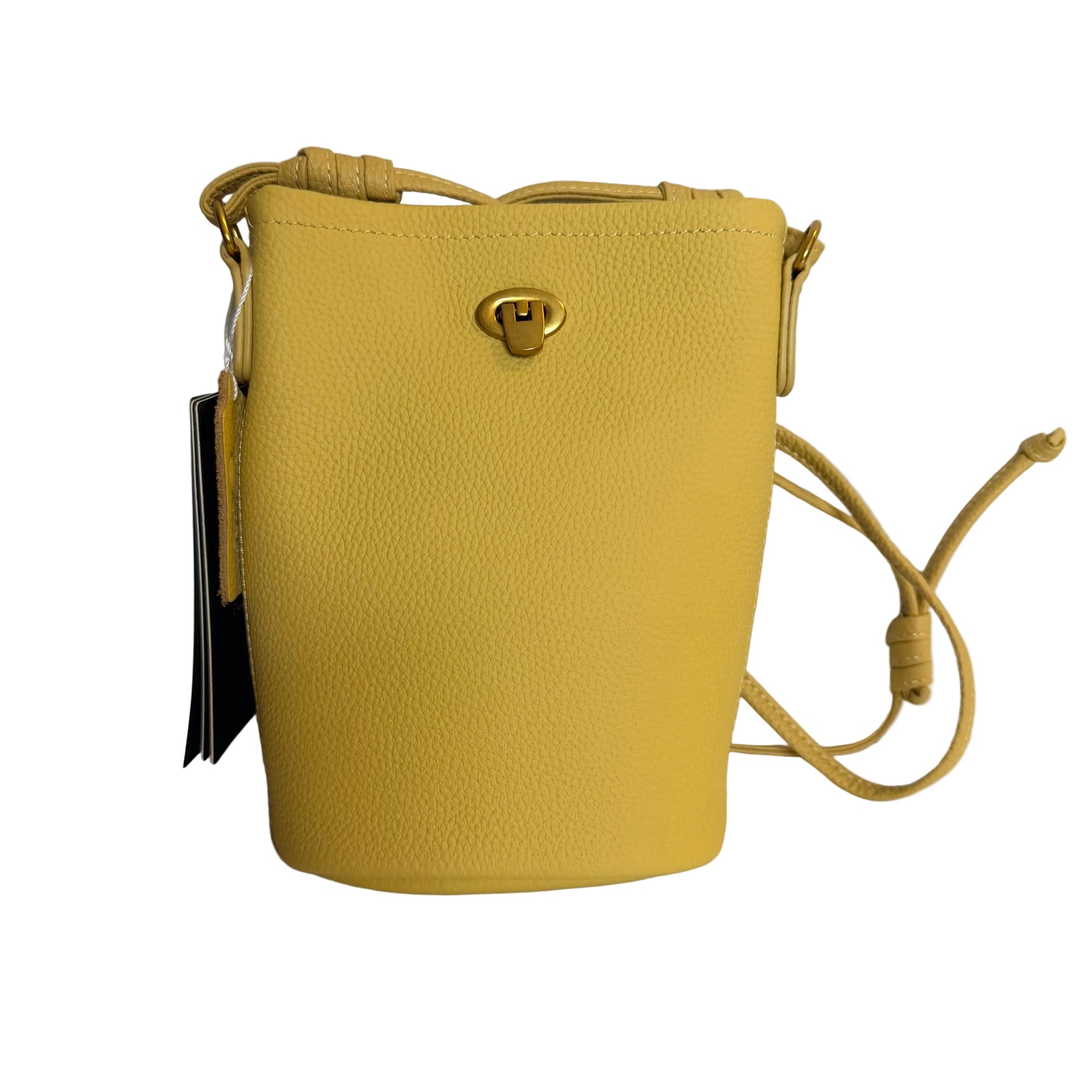 Yellow leather handbag with a strap on a light gray background