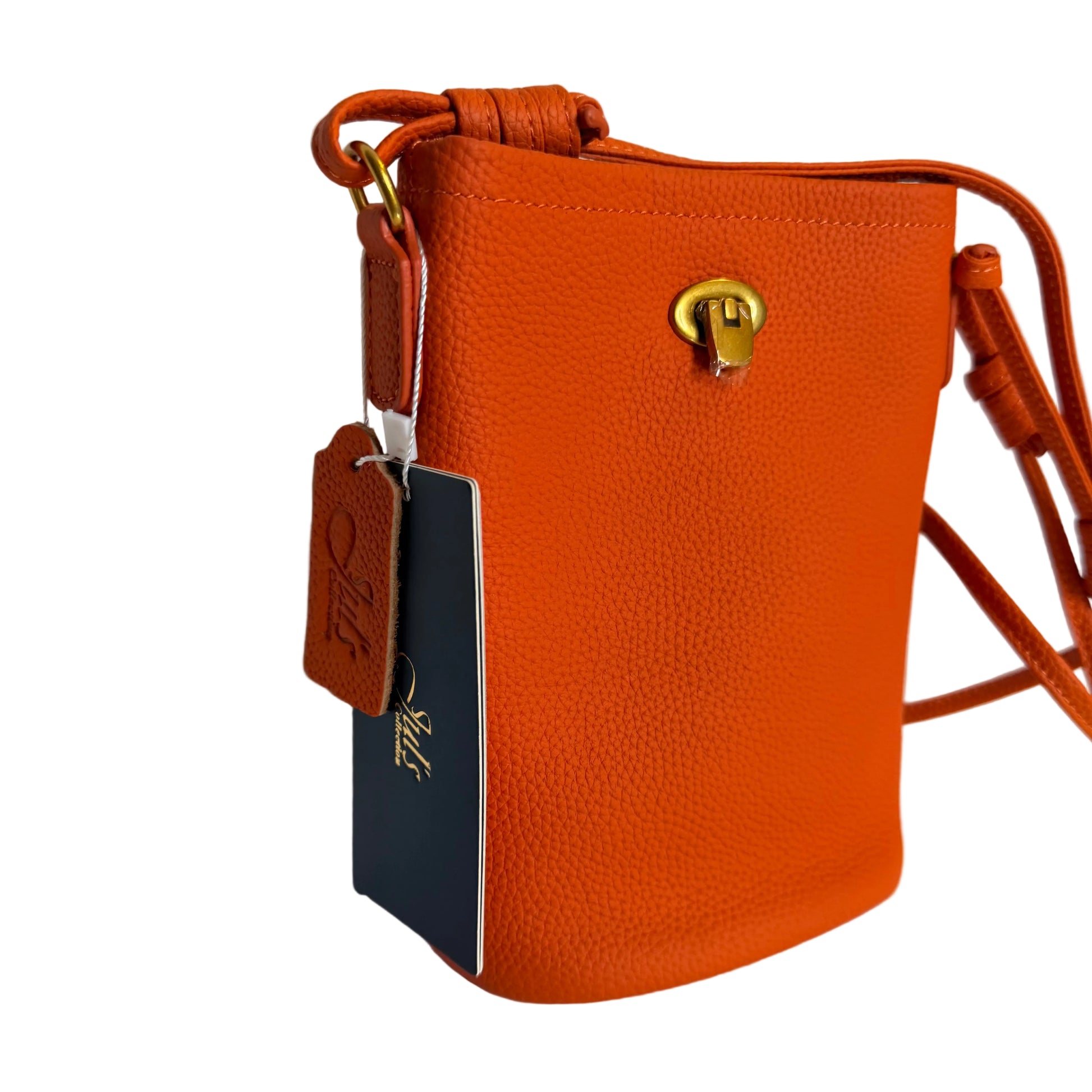 Orange leather handbag with a visible brand tag on a white background