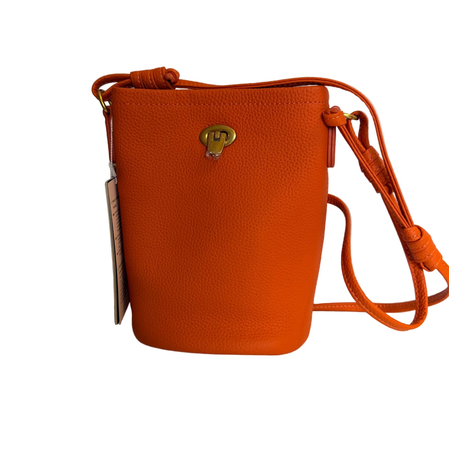 Orange leather handbag with a strap on a light gray background