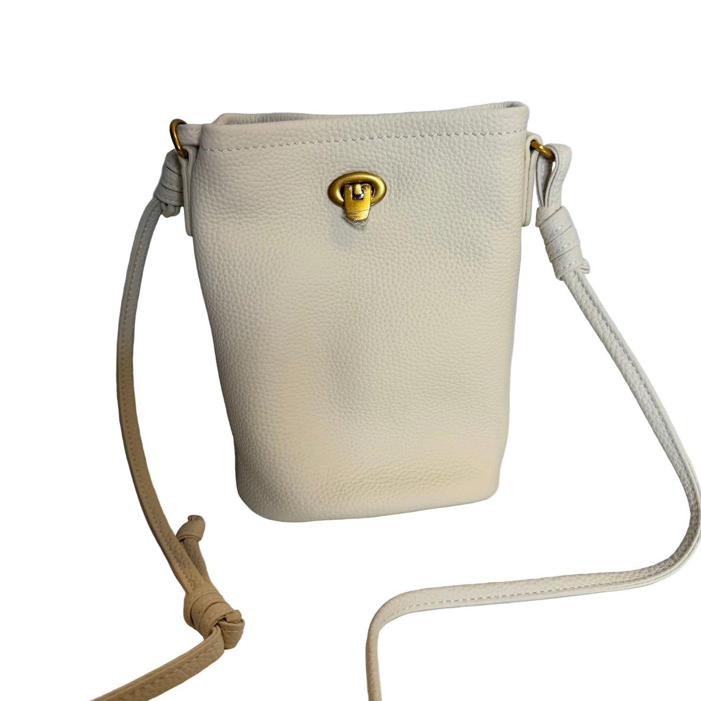 Beige handbag with a gold clasp on a light blue background