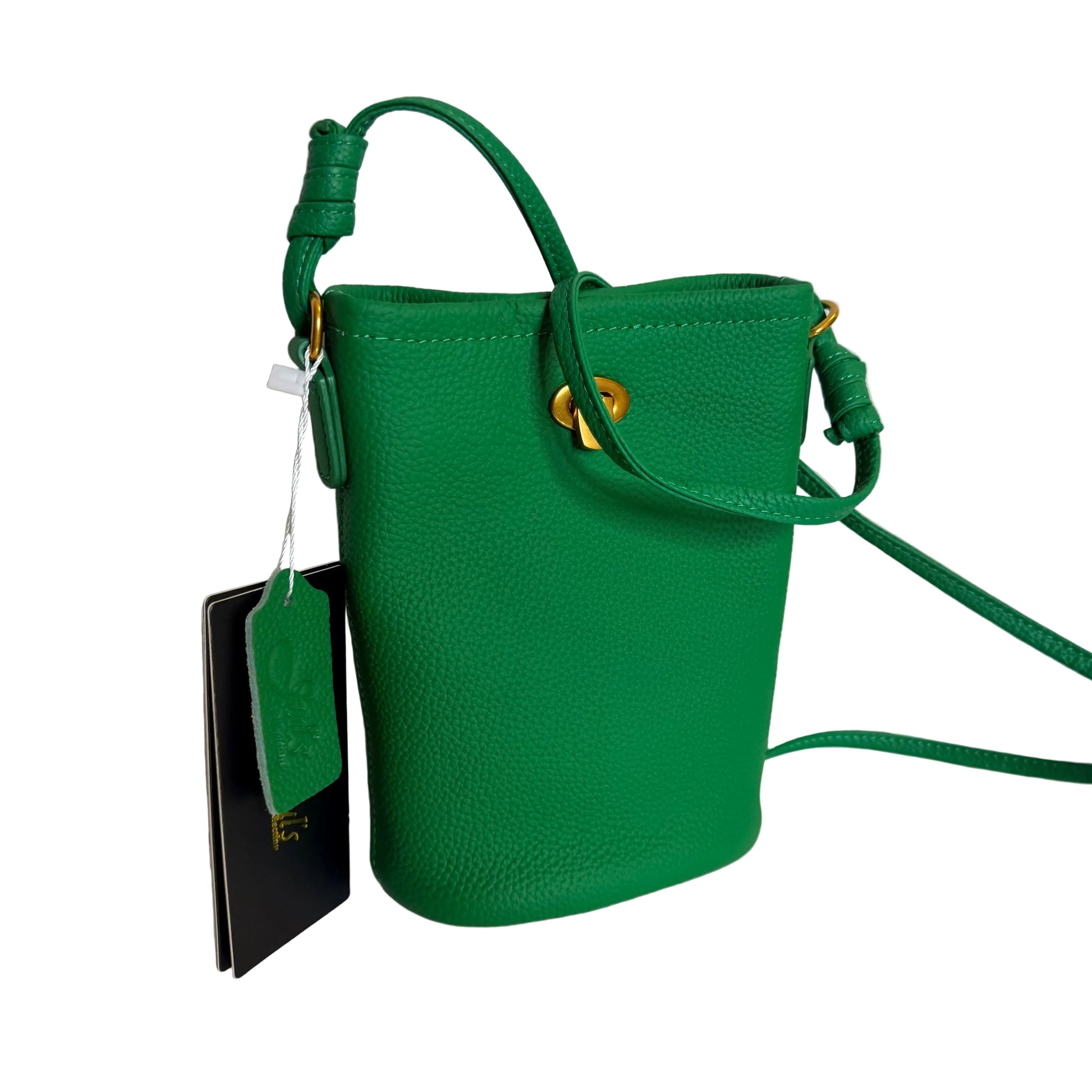 Green handbag with a tag on a white background