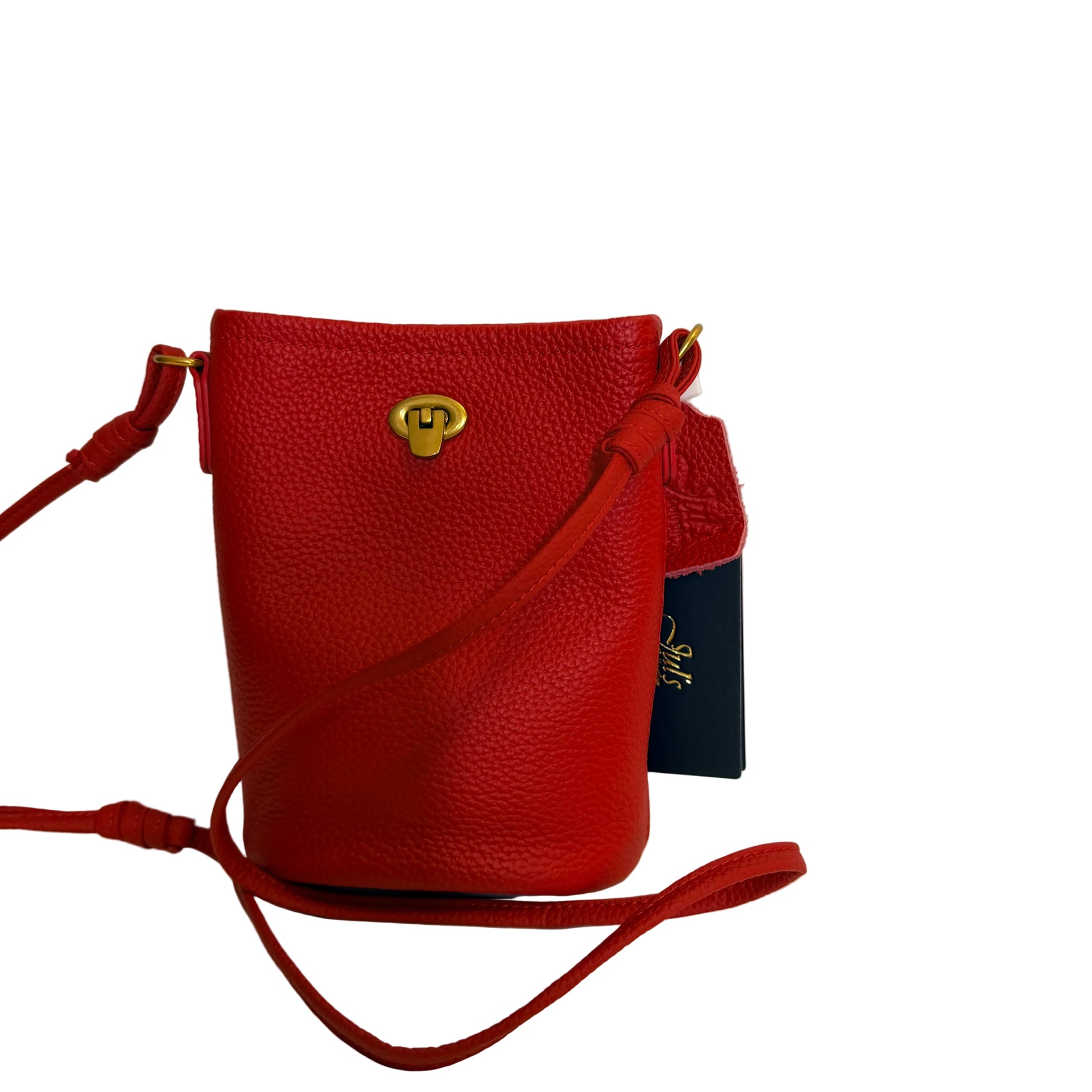 Red leather handbag with a gold clasp on a white background