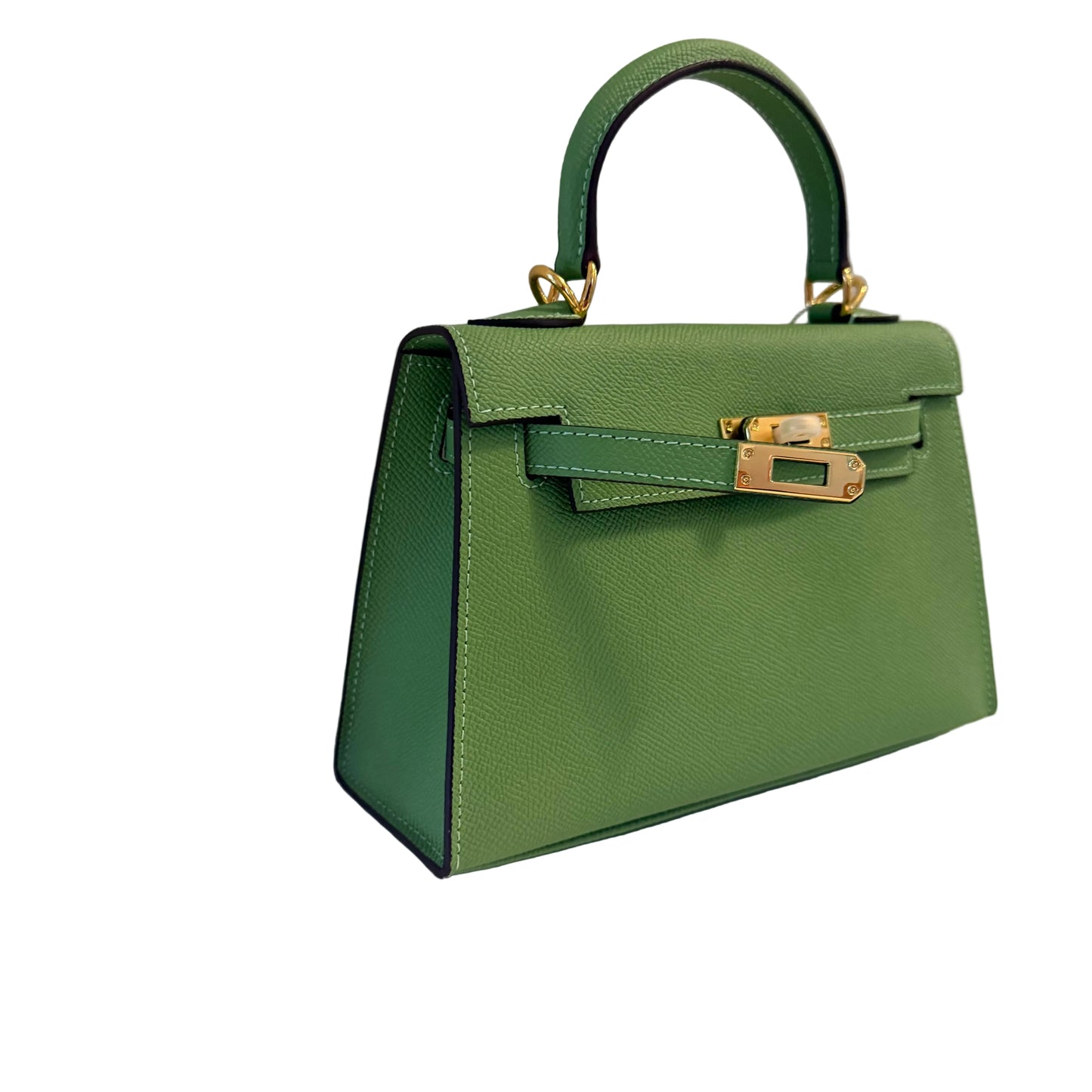 Green handbag with gold hardware on a white surface