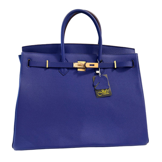 Blue handbag with a gold clasp on a white surface