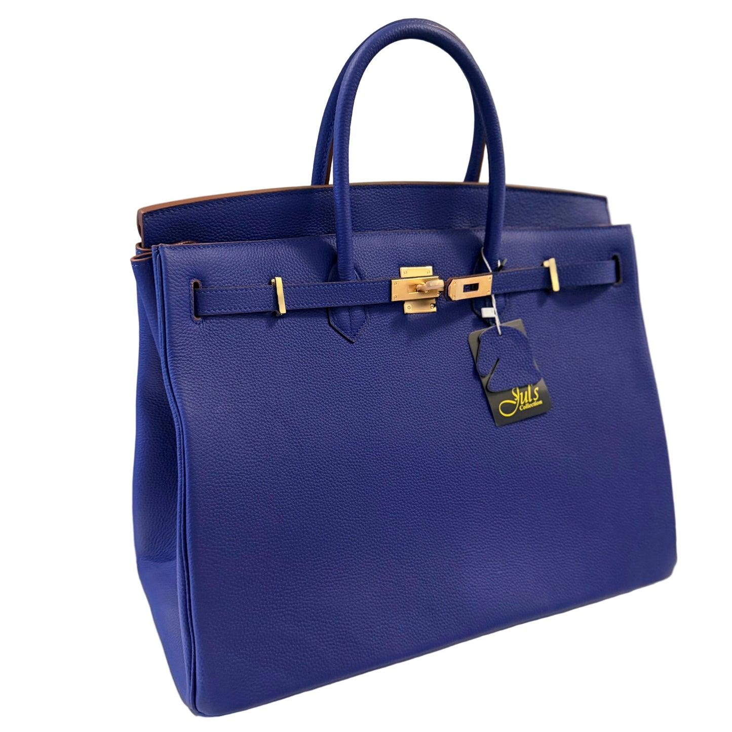 Blue handbag with gold hardware on a light surface