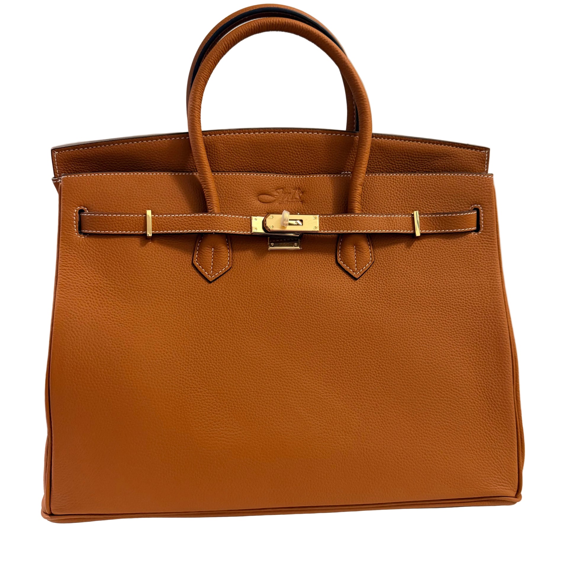 Brown leather handbag with gold hardware on a light gray background