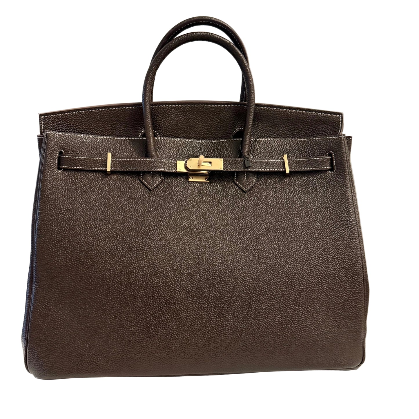 Brown leather handbag with gold hardware on a light gray background