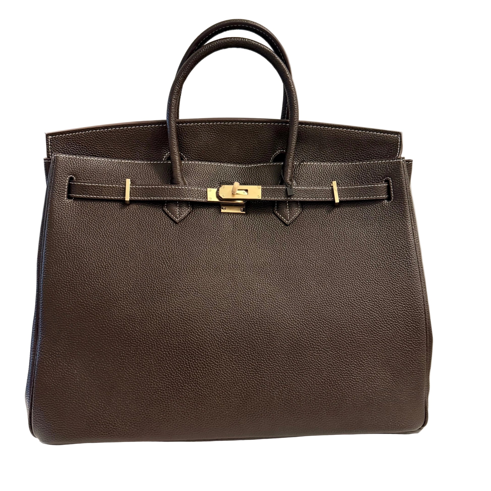 Brown leather handbag with gold hardware on a light gray background