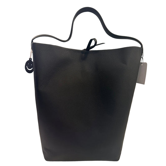 Black handbag on a white surface with a neutral background