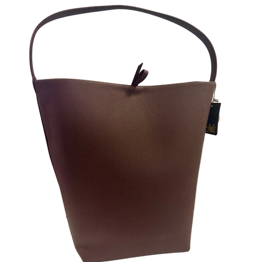 Brown leather handbag with a visible brand tag on a light gray background