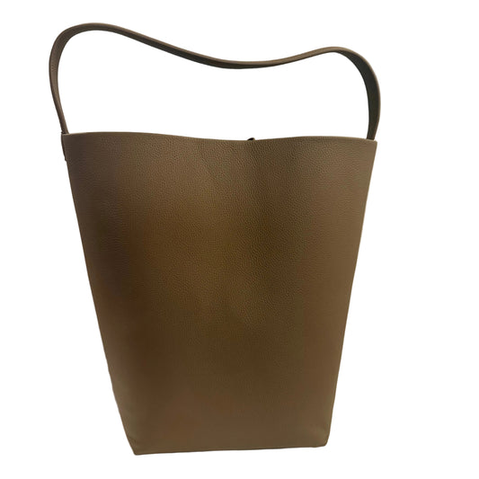 Brown leather handbag with a handle on a light gray background