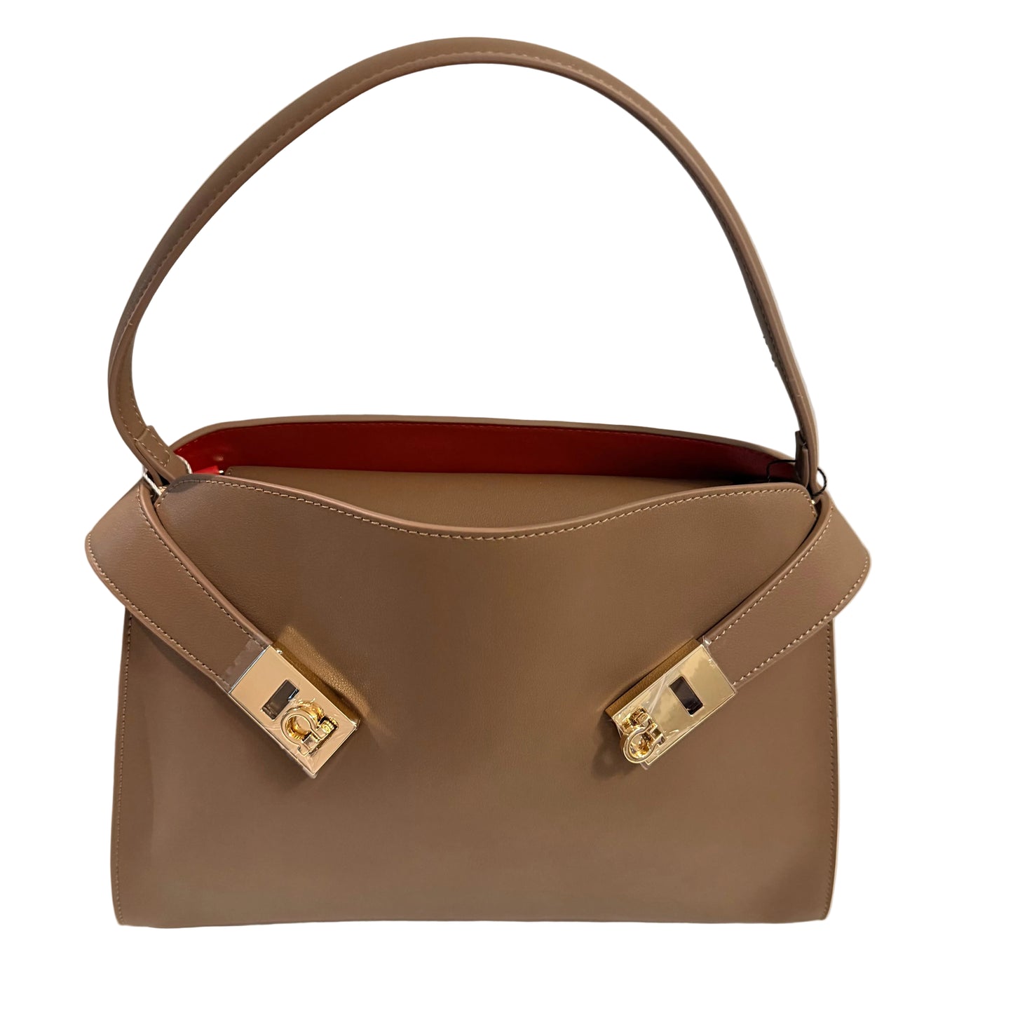 Brown handbag with gold hardware on a light gray background
