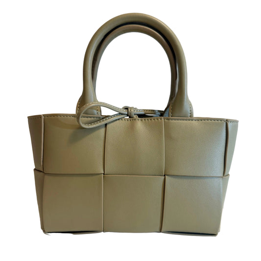 A structured woven leather handbag in a muted sage green, featuring a top handle and a decorative leather tie detail, shown against a plain off-white background.